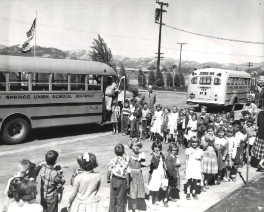 Students lining up to take the bus Students lining up to take the bus